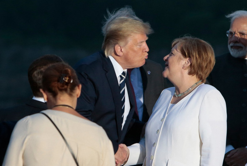 G7 - President Trump Kisses Chancellor Merkel