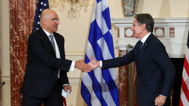 US Secretary of State Antony Blinken (R) and Greek Foreign Minister Nikos Dendias shake hands