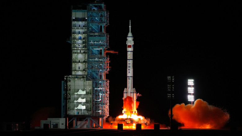 The crewed spaceship Shenzhou-13, atop a Long March-2F carrier rocket, is launched from the Jiuquan Satellite Launch Center in northwest China's Gobi Desert