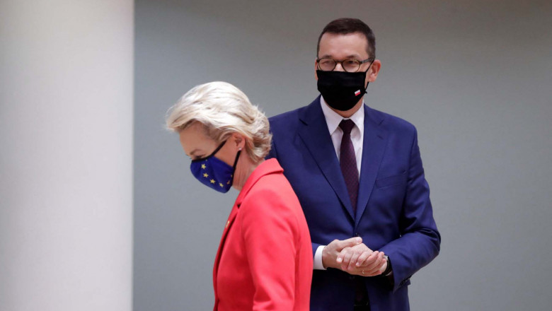 Euopean Commission President Ursula von der Leyen (L) and Poland’s Prime Minister Mateusz Morawiecki (R) arrive for an EU summit at the European Council building in Brussels