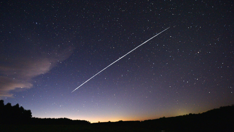 This long-exposure image shows a trail of a group of SpaceX's Starlink satellites passing over Uruguay as seen from the countryside some 185 km north of Montevideo near Capilla del Sauce