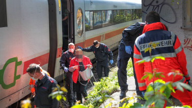 Rescue workers help evacuate an Intercity Express (ICE) in Wuppertal.