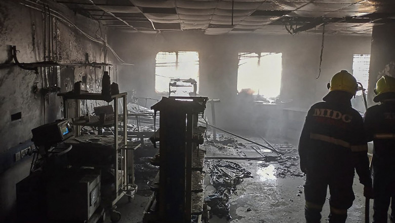 Firefighters inspect a ward after a fire broke out at a hospital in Ahmednagar district on November 6, 2021