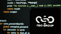 NSO Group logo seen on smartphone placed in front of laptop with simple hacking code. Selective focus. Stafford, United Kingdom, July 19, 2021.