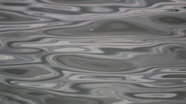 close up of wave patterns on water