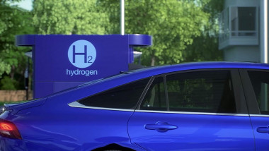 Close-up of blue electric sports car charging at a hydrogen charging station