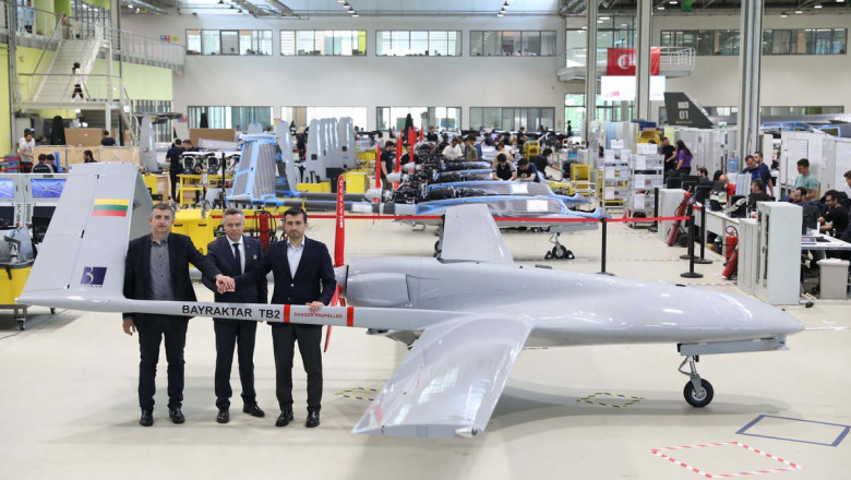 Lithuanian Defence Vice Minister Vilius Semeska (C) meeting drone manufacturing company Baykar's CEO Haluk Bayraktar (L) and CTO Selcuk Bayraktar in Istanbul, to finalise the purchase of a combat drone for Ukrainian forces fighting Russia's invasion