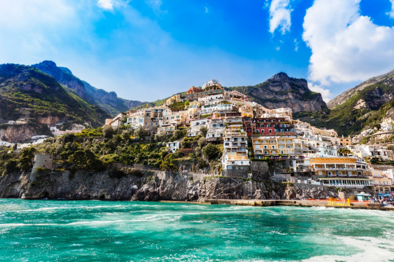 Cliff side buildings by sea, Positano, Amalfi Coast, Italy