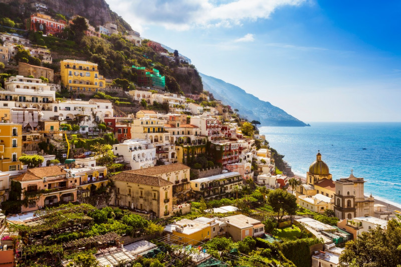 Cliff side buildings by sea, Positano, Amalfi Coast, Italy