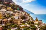 Cliff side buildings by sea, Positano, Amalfi Coast, Italy