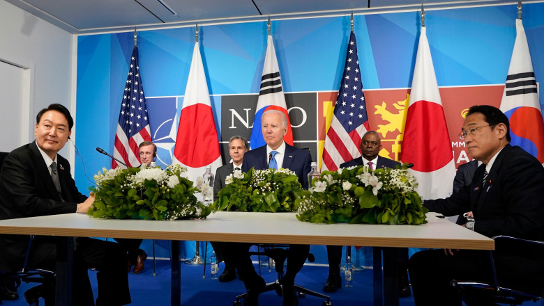 President Joe Biden, center, meets with South Korea's President Yoon Suk Yeol, left, and Japan's Prime Minister Fumio Kishida, right, during the NATO summit in Madrid