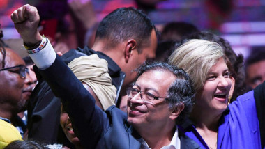Gustavo Petro (C) celebrates with his wife Veronica Alcocer (R) at the Movistar Arena in Bogota, on June 19, 2022