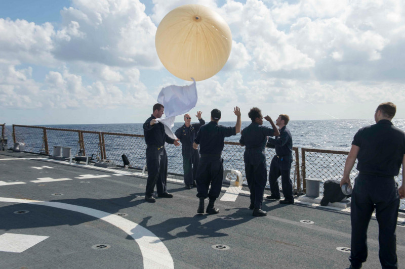 151025-N-TC720-249 MEDITERRANEAN SEA (Oct. 25, 2015) Sailors aboard USS Donald Cook (DDG 75) release a helium filled balloon during radar tests Oct. 25, 2015. Donald Cook, an Arleigh Burke-class guided-missile destroyer, forward deployed to Rota, Spain is