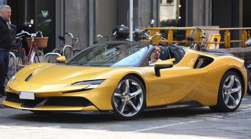 *EXCLUSIVE* AC Milan footballer Zlatan Ibrahimovic was pictured looking cool while driving his yellow Ferrari in the center of Milan.