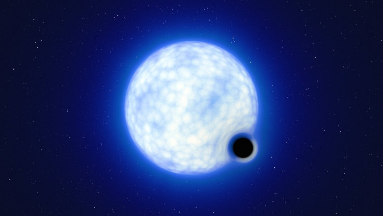 imagine reprezentand o stea mare alba si o gaura neagra mica