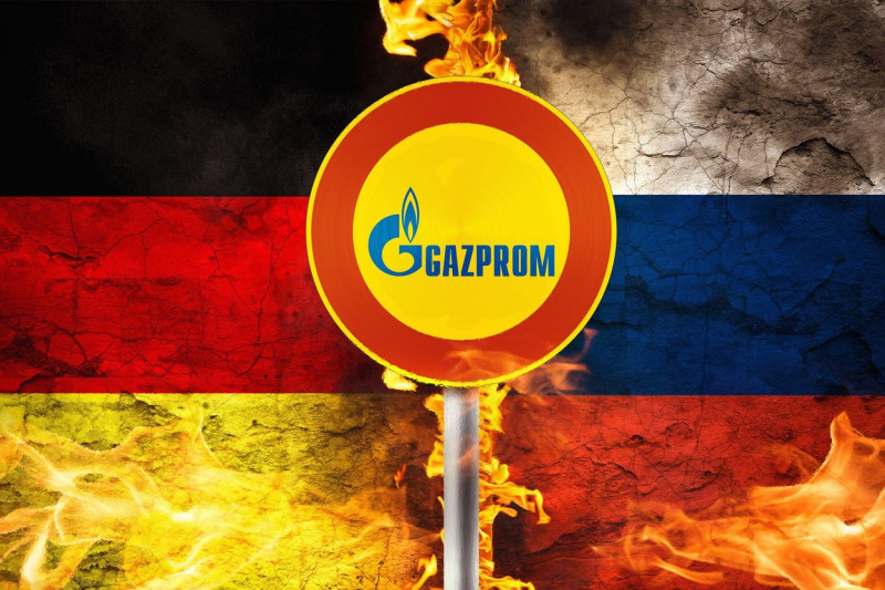 Conflict Germany Russia, Country Flags In Flames With A Sign GAZPROM Logo, Gas And Energy Supply And Supply From Russia PHOTOMONTAGE