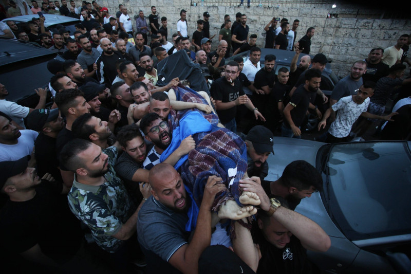 Relatives of Palestinians Mohammad Al-Azizi and Abboud Sobh, who were killed by Israeli forces, mourn during their funeral, Nablus, West Bank, Palestinian Territory - 24 Jul 2022