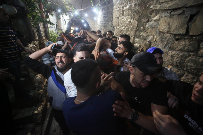 Relatives of Palestinians Mohammad Al-Azizi and Abboud Sobh, who were killed by Israeli forces, mourn during their funeral, Nablus, West Bank, Palestinian Territory - 24 Jul 2022
