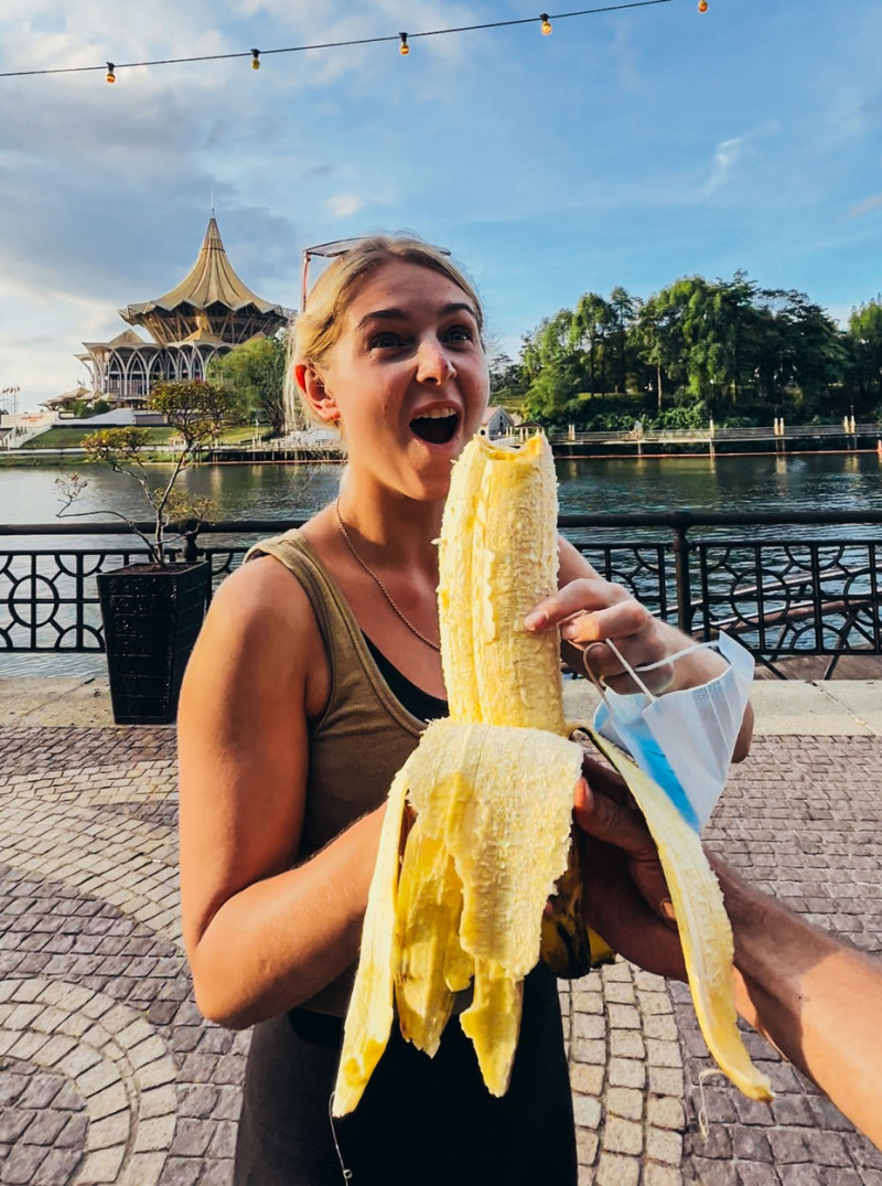 COUPLE EAT GIANT BANANA WHILE TRAVELLING