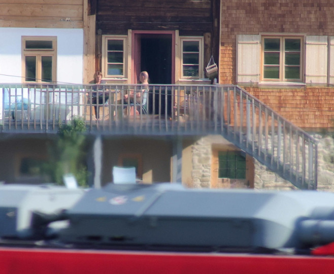 EXCLUSIVE: German chancellor Olaf Scholz and his wife Britta Ernst sitting on the porch of their rented holiday home in the Allgaeu region of Bavaria, Germany.