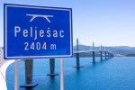 New Peljesac Bridge sign is seen at begining of Peljesac bridge in Komarna, Croatia on June 21, 2022. Peljesac bridge has passed a technical inspection and will be opened along with 20 kilometres of access roads in end of July this year. Photo: Milan Sabi