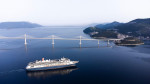 Komarna, Croatia. 23rd June, 2022. Aerial photo of the passage of the first large cruiser under the Peljesac Bridge in Komarna, Croatia on June 23, 2022. The cruiser Bolette under the command of Dubrovnik Captain Jozo Glavic with just over a thousand pass