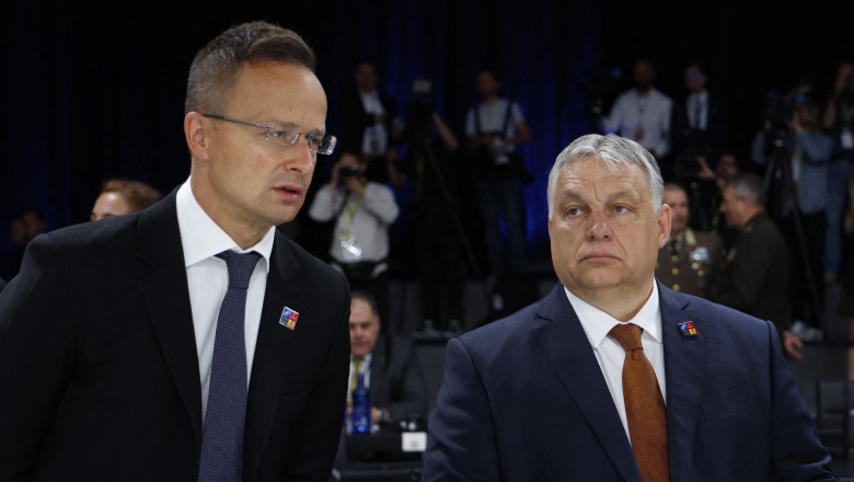 Hungary's President Viktor Orban (R), Hungary's Foreign Minister Peter Szijjarto