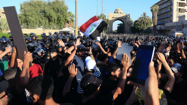 Protesters gather outside the heavily fortified Green Zone in Baghdad, Iraq,