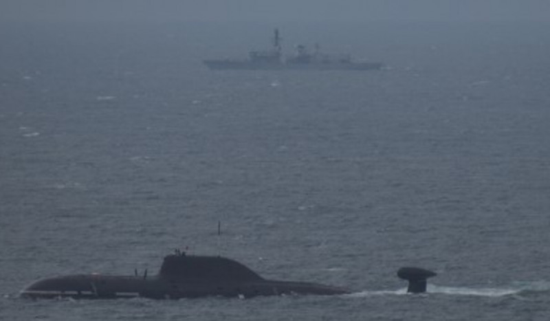 A Royal Navy warship has tracked the movements of two Russian submarines as they sailed into the North Sea.