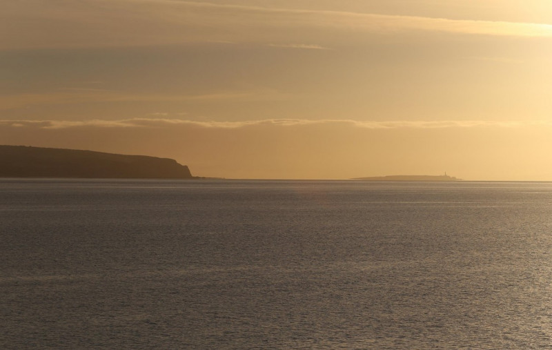 Island of Pladda with the cliffs of Bennan Head Isle of Arran at dawn Scotland September 2016