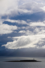 Dramatic clouds over Pladda island, off the south coast of Isle of Arran, North Ayrshire, Scotland