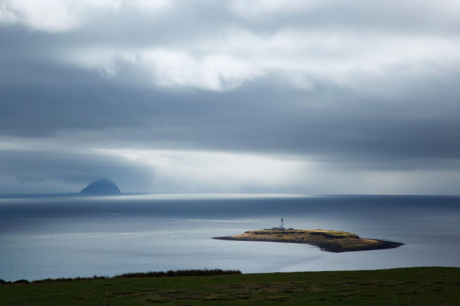 The Island of Pladda with Ailsa Craig in the Distance. Isle of Arran, Scotland, UK.