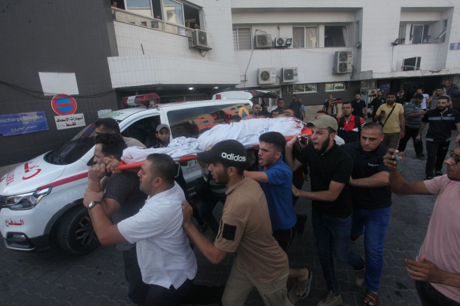 Palestinians mourn over the body of Tayseer al-Jabari, a commander in Saraya al-Quds, the military wing of Islamic Jihad, Gaza city, Gaza Strip, Palestinian Territory - 05 Aug 2022