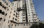 Palestinians gather near a building following an Israeli air strike in Gaza, Gaza city, Gaza Strip, Palestinian Territory - 05 Aug 2022