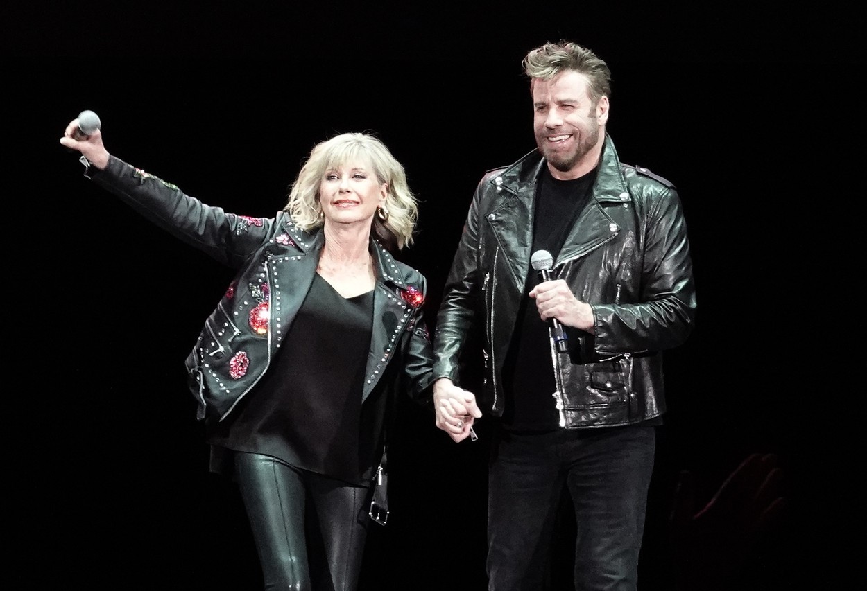 John Travolta and Olivia Newton John recreate their iconic Grease characters in full costume at a Meet N Grease sing-a-long in West Palm Beach
