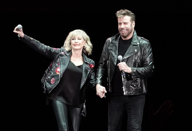 John Travolta and Olivia Newton John recreate their iconic Grease characters in full costume at a Meet N Grease sing-a-long in West Palm Beach