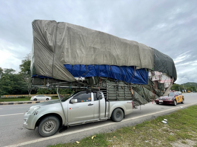 Wide load! Super-stacked pickup truck pulled over by police in Thailand