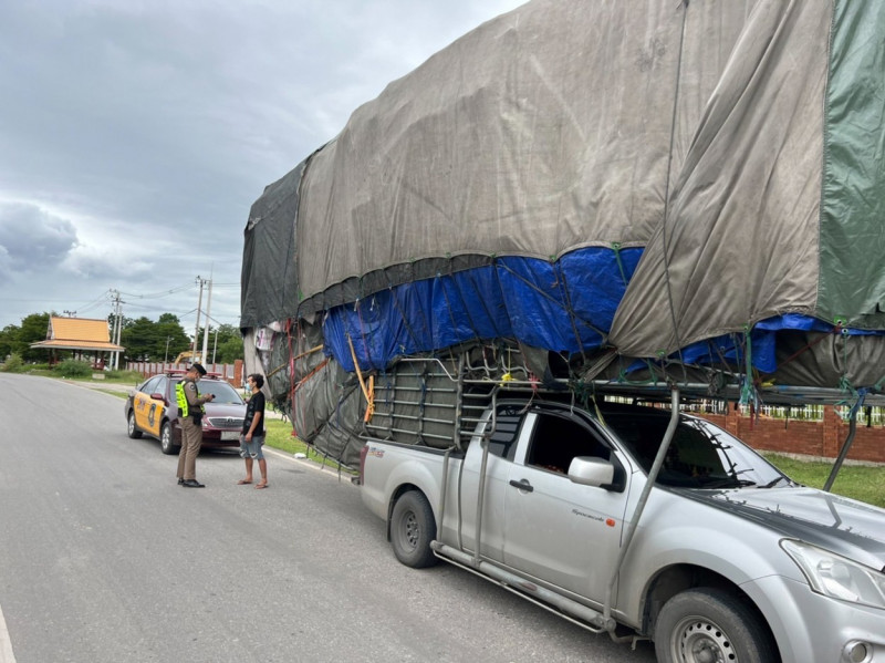 Wide load! Super-stacked pickup truck pulled over by police in Thailand