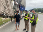 Wide load! Super-stacked pickup truck pulled over by police in Thailand