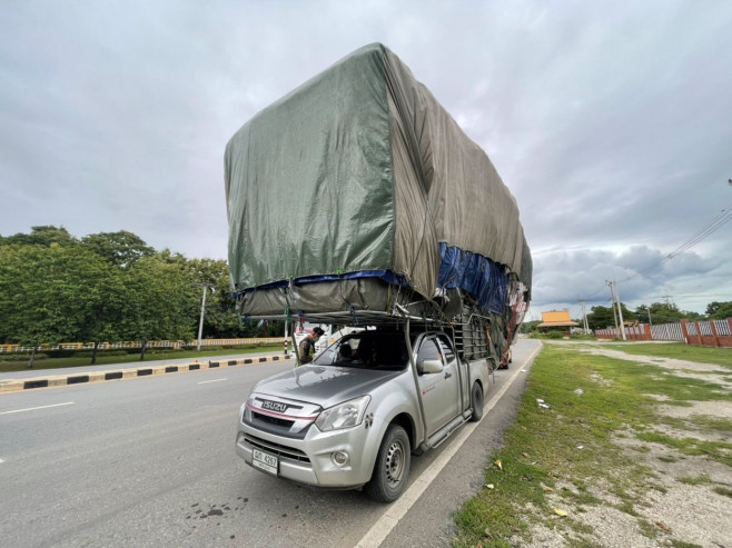 Wide load! Super-stacked pickup truck pulled over by police in Thailand