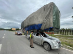 Wide load! Super-stacked pickup truck pulled over by police in Thailand