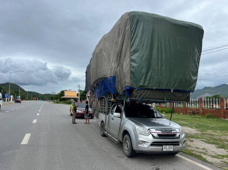 Wide load! Super-stacked pickup truck pulled over by police in Thailand