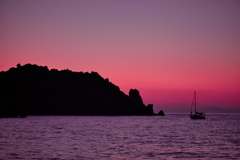 Purple light at dusk over the sea at Giglio Island, Tuscan Archipelago, Italy.