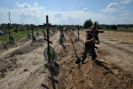 Burial of unidentified civilians who were killed by the Russian military in Bucha - 17 Aug 2022