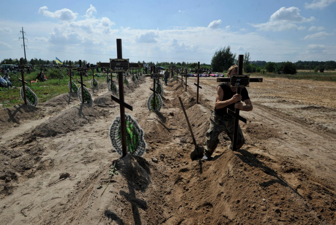 Burial of unidentified civilians who were killed by the Russian military in Bucha - 17 Aug 2022