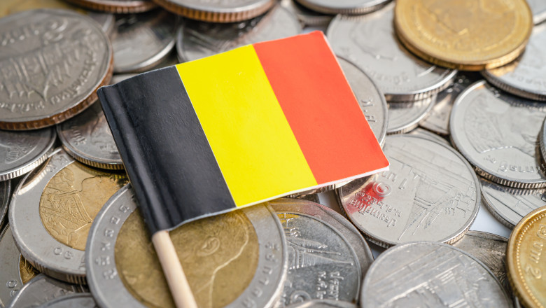 Stack of coins with germany flag on white background. flag on white background.