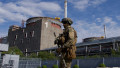 A Russian serviceman patrols the territory of the Zaporizhzhia Nuclear Power Station in Energodar.