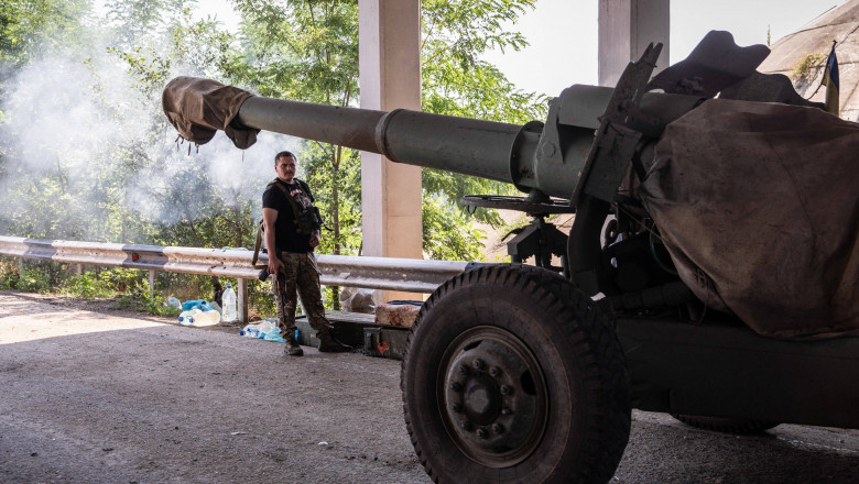 A Ukrainian soldier of the artillery battalion seen waiting for further orders next to a 152mm artillery close to the frontline at an undisclosed position in Mykolaiv Oblast, Ukraine