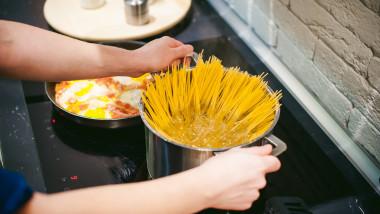 woman housewife preparing pasta in the kitchen