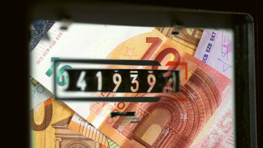 An electricity meter and Euro banknotes